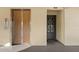 Building entrance featuring an elevator and entryway to unit 305 at 2440 Winding Creek Blvd # 305, Clearwater, FL 33761