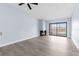 Open-concept living room with a fireplace and sliding glass doors to the balcony at 2440 Winding Creek Blvd # 305, Clearwater, FL 33761