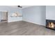 Spacious living room with a breakfast bar, modern flooring, and a cozy fireplace at 2440 Winding Creek Blvd # 305, Clearwater, FL 33761