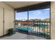 Relaxing patio view of the community pool and tennis court at 2440 Winding Creek Blvd # 305, Clearwater, FL 33761