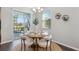 Cozy dining room with contemporary table set, neutral decor, and natural light at 29917 Southwell Ln, Wesley Chapel, FL 33543