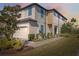 Charming townhome boasts beautiful landscaping and a convenient attached two-car garage at 29917 Southwell Ln, Wesley Chapel, FL 33543