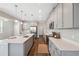 Open kitchen offers stainless appliances, center island, light countertops, and ample cabinet space at 29917 Southwell Ln, Wesley Chapel, FL 33543
