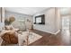 Inviting sitting area featuring comfortable wicker chairs, neutral colors, and natural light from the window at 29917 Southwell Ln, Wesley Chapel, FL 33543