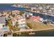 Aerial view of waterfront home featuring a backyard pool and private boat dock at 3073 Gulf Winds Cir, Hernando Beach, FL 34607