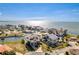 Stunning aerial view of waterfront home showcasing canal access and beautiful ocean views at 3073 Gulf Winds Cir, Hernando Beach, FL 34607
