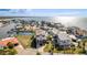 Aerial view of a waterfront home with a dock on a canal leading to the ocean at 3073 Gulf Winds Cir, Hernando Beach, FL 34607