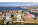 Waterfront property features a pool, dock, and stunning views of the surrounding waterways and neighborhood at 3073 Gulf Winds Cir, Hernando Beach, FL 34607