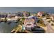 Aerial shot of a home with a swimming pool and dock, with ocean views at 3073 Gulf Winds Cir, Hernando Beach, FL 34607