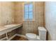 Bathroom with ceramic tile, a large vanity, and a toilet at 3073 Gulf Winds Cir, Hernando Beach, FL 34607