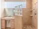 This bathroom features a modern walk-in shower with glass block accents and a bright, open feel at 3073 Gulf Winds Cir, Hernando Beach, FL 34607