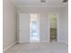 Bedroom features soft carpet, ceiling fan, an ensuite, and a walk-in closet at 3073 Gulf Winds Cir, Hernando Beach, FL 34607