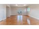 Spacious bedroom with polished hardwood floors and sliding glass doors to a balcony at 3073 Gulf Winds Cir, Hernando Beach, FL 34607
