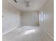 Spacious bedroom with carpeted floor, a ceiling fan, and bright windows at 3073 Gulf Winds Cir, Hernando Beach, FL 34607
