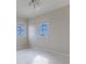 Well-lit room with carpeted floor and two windows offering outside views and natural light at 3073 Gulf Winds Cir, Hernando Beach, FL 34607