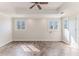 Bright bedroom featuring recessed ceilings, tile floors, and large windows at 3073 Gulf Winds Cir, Hernando Beach, FL 34607