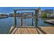 Modern boat lift provides easy access to the open water, perfect for boating enthusiasts at 3073 Gulf Winds Cir, Hernando Beach, FL 34607