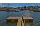 Waterfront property featuring a private dock with direct access to the canal at 3073 Gulf Winds Cir, Hernando Beach, FL 34607