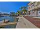 Waterfront living with canal access, dock, and lush landscaping creating an inviting outdoor space at 3073 Gulf Winds Cir, Hernando Beach, FL 34607