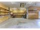 Garage with concrete flooring and lots of shelving at 3073 Gulf Winds Cir, Hernando Beach, FL 34607