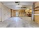 Spacious garage with ample room for storage and a ceiling fan at 3073 Gulf Winds Cir, Hernando Beach, FL 34607