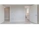 Hallway showcasing a bathroom entrance with a vanity, toilet, and tiled floors at 3073 Gulf Winds Cir, Hernando Beach, FL 34607