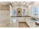 Kitchen features granite counters, mosaic backsplash, and white cabinetry at 3073 Gulf Winds Cir, Hernando Beach, FL 34607