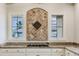 Close up on tile backsplash over the gas range cooktop and granite countertops at 3073 Gulf Winds Cir, Hernando Beach, FL 34607