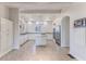 Bright kitchen with white cabinets, granite countertops, and stainless steel appliances at 3073 Gulf Winds Cir, Hernando Beach, FL 34607