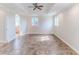 Spacious living room with tile flooring, tray ceilings, and large windows providing plenty of natural light at 3073 Gulf Winds Cir, Hernando Beach, FL 34607