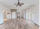 Bright living room featuring wood-look tile flooring and white, beamed ceilings at 3073 Gulf Winds Cir, Hernando Beach, FL 34607