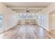 Spacious living room featuring hardwood floors, bright windows and wood beam ceilings at 3073 Gulf Winds Cir, Hernando Beach, FL 34607