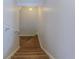 Staircase with carpet leading down, featuring a white handrail and neutral walls at 3073 Gulf Winds Cir, Hernando Beach, FL 34607