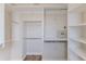 Walk-in closet with ample shelving and storage space at 3073 Gulf Winds Cir, Hernando Beach, FL 34607