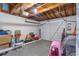Open garage with white door and storage items at 3542 Connon Dr, New Port Richey, FL 34652