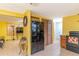 Functional kitchen featuring modern black appliances, tile flooring, and adjacent living space at 3542 Connon Dr, New Port Richey, FL 34652