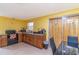 Traditional kitchen features wood cabinetry, black appliances and tile floors at 3542 Connon Dr, New Port Richey, FL 34652