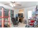 Bright sun room with ceiling fan and television at 3542 Connon Dr, New Port Richey, FL 34652