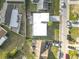 A high definition aerial shot of the property showing the house, roof, landscaping, and surrounding neighborhood at 3640 Richboro Dr, Holiday, FL 34691