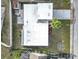 Aerial view of the home showing the roof, driveway, landscaping, and surrounding area at 3640 Richboro Dr, Holiday, FL 34691
