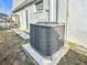 A close view of the outside AC unit, showing good condition and recent maintenance of the home's cooling system at 3640 Richboro Dr, Holiday, FL 34691