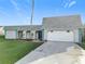 Charming single-story home with an attached garage and well-manicured front lawn at 3640 Richboro Dr, Holiday, FL 34691