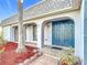 Welcoming front entrance with unique double doors and meticulous landscaping at 3640 Richboro Dr, Holiday, FL 34691