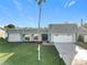 Charming single-story home featuring an attached garage and well-manicured lawn at 3640 Richboro Dr, Holiday, FL 34691