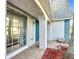 Home exterior featuring a covered porch, tiled flooring and mature landscaping at 3640 Richboro Dr, Holiday, FL 34691
