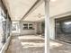 Large screened lanai with tile flooring offers the perfect space for outdoor living and entertaining at 3640 Richboro Dr, Holiday, FL 34691