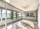 Large screened lanai with tile flooring offers the perfect space for outdoor living and entertaining at 3640 Richboro Dr, Holiday, FL 34691