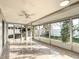 Large screened lanai with tile flooring offers the perfect space for outdoor living and entertaining at 3640 Richboro Dr, Holiday, FL 34691