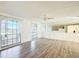 Spacious living room filled with natural light and stylish wood-look flooring at 3640 Richboro Dr, Holiday, FL 34691