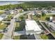 A high definition aerial shot of the property showing the surrounding neighborhood and nearby waterfront at 3640 Richboro Dr, Holiday, FL 34691